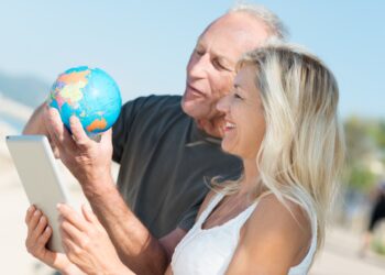 happy middle aged couple deciding on their next vacation