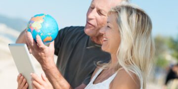 happy middle aged couple deciding on their next vacation