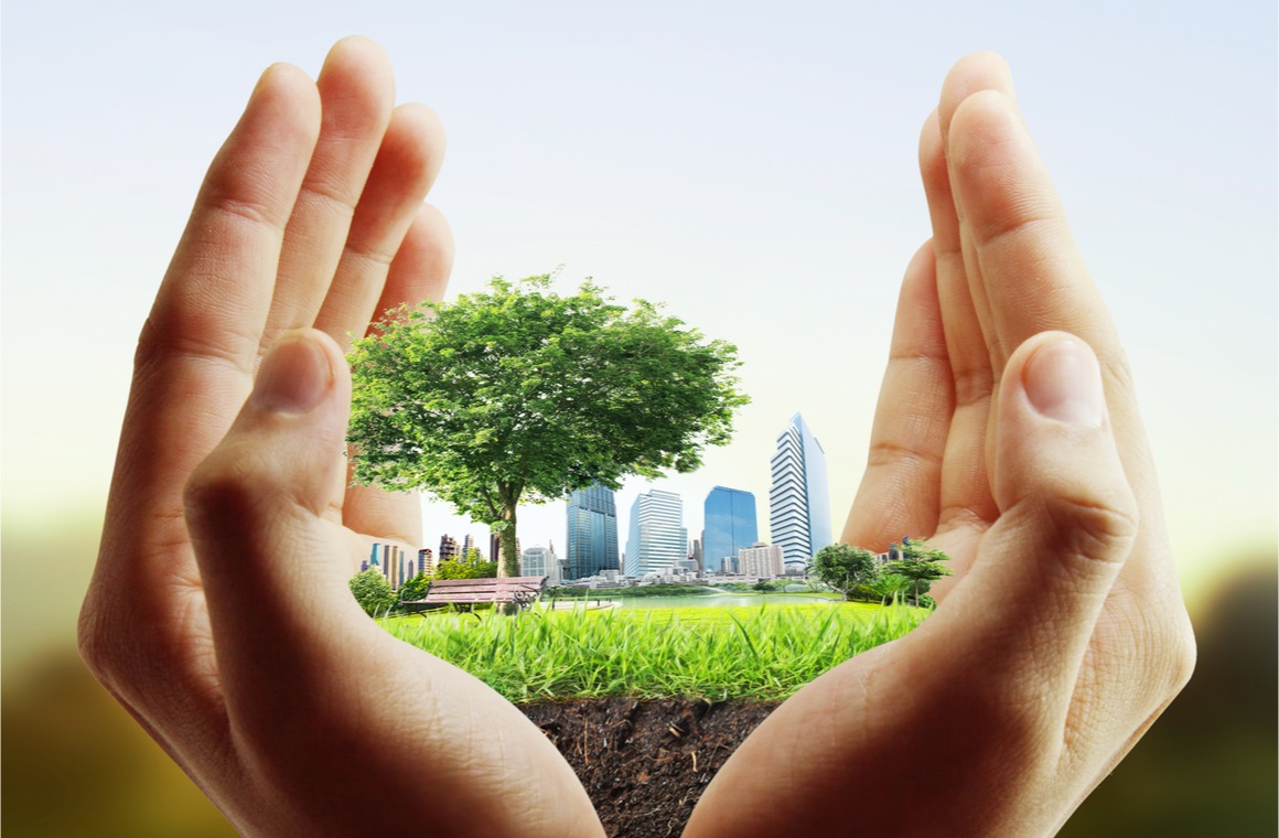 human hand holding the city