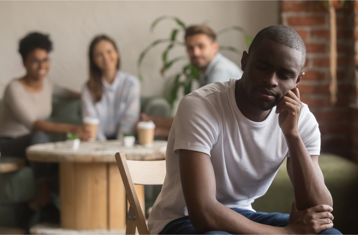 Unhappy guy sitting alone