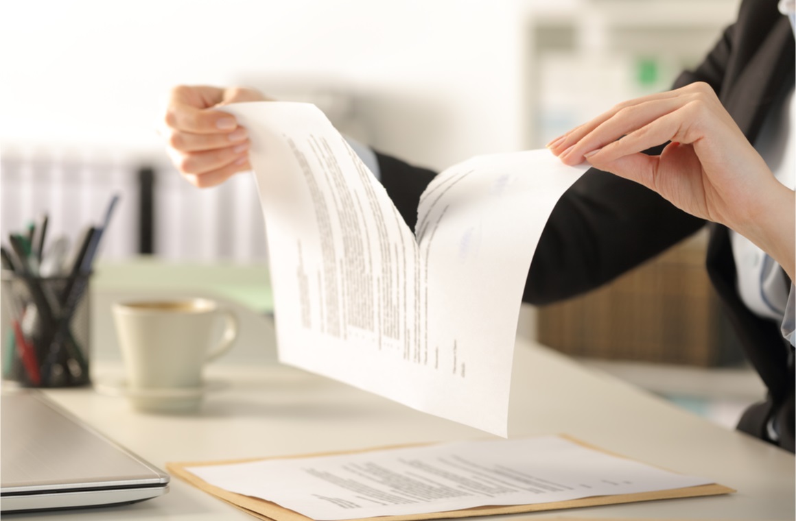 woman hands breaking contract document