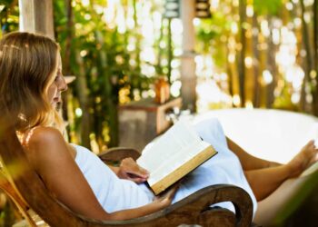 Attractive girl sitting in rocking chair