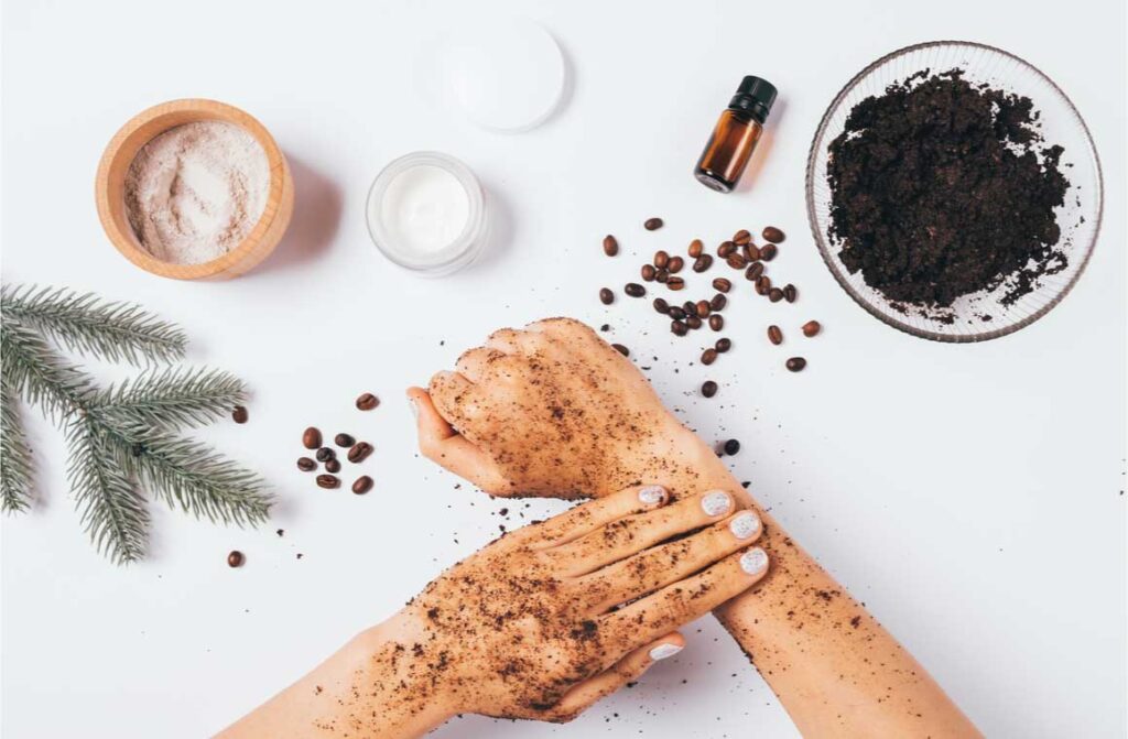 Flat lay female hands coffee peeling