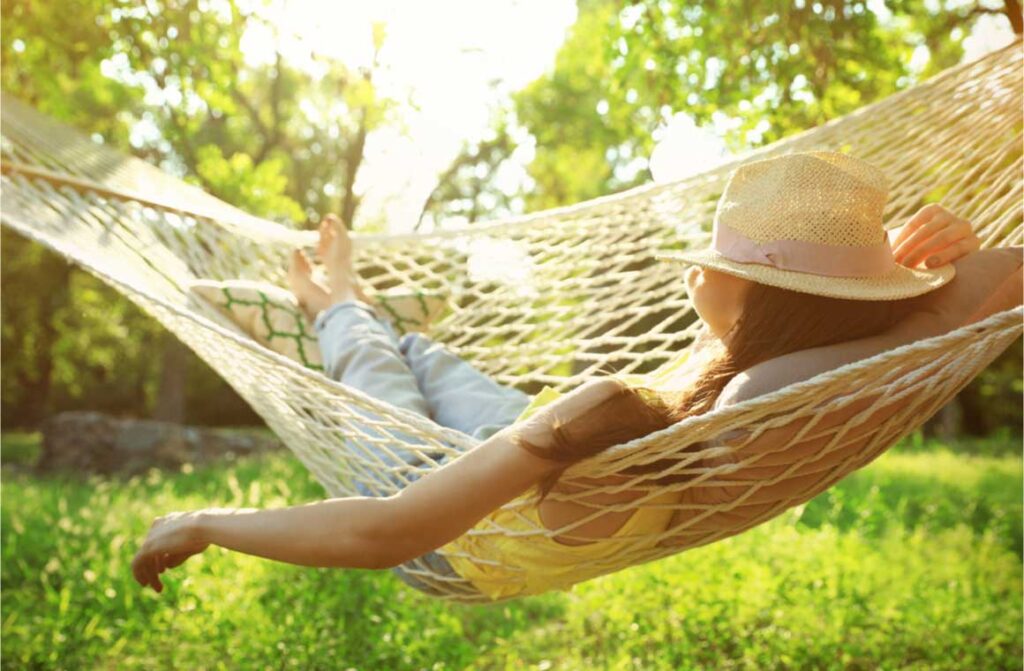 Young woman resting comfortable in hammock