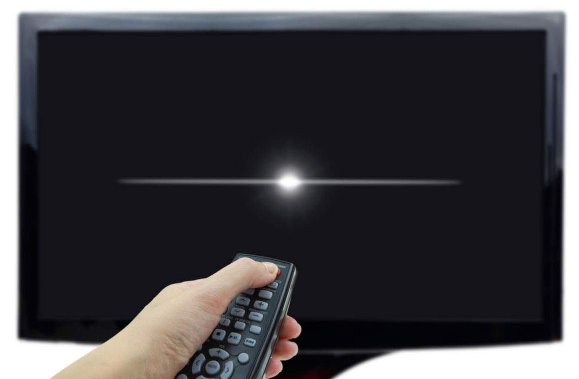 hand remote control in front of a black tv