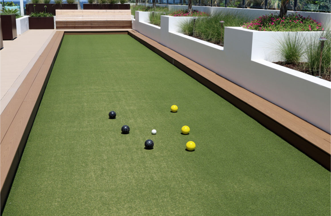 inviting bocce ball court with artificial turf