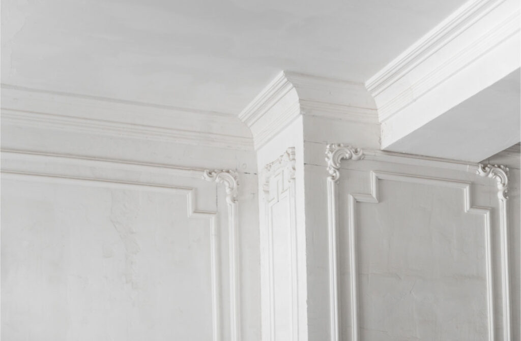 Unfinished intricate crown molding on column