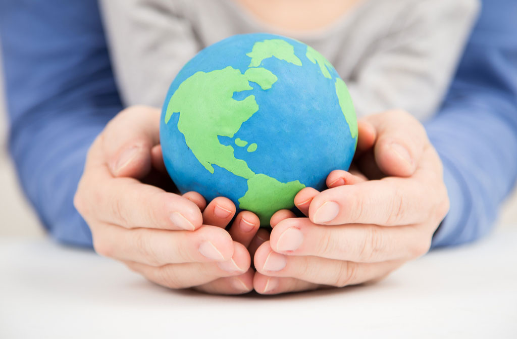 father daughter holding earth globe