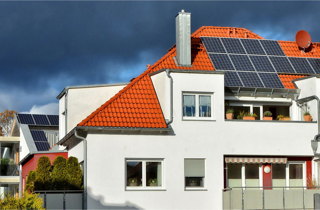 solar panels on red tile roof