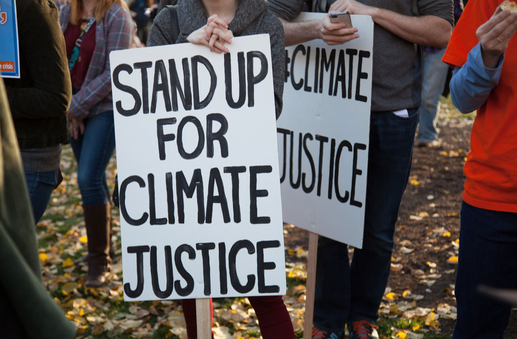 group of people stand for climate change