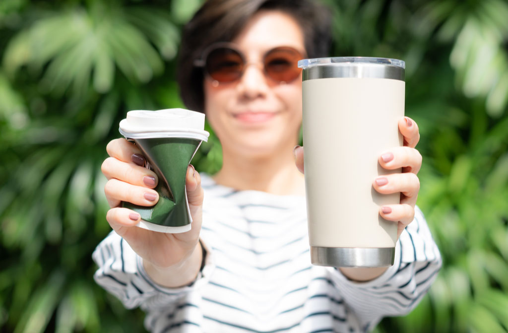 beautiful stylish woman holding coffee