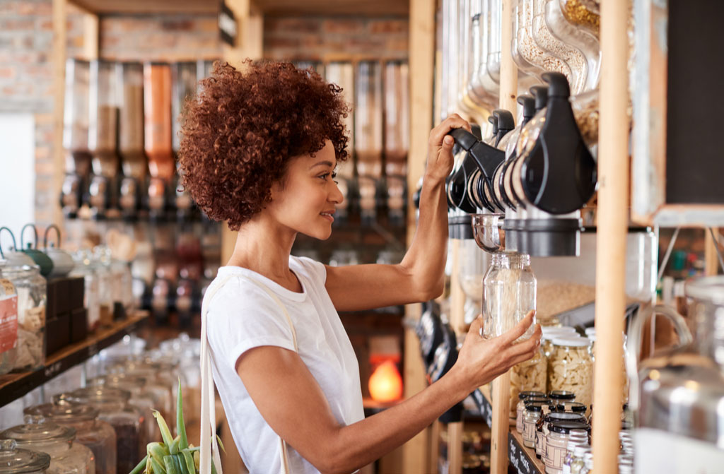 woman buying cereals grains sustainable