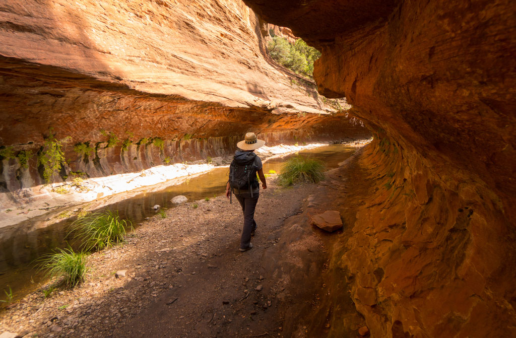 woman hiking canyon desert