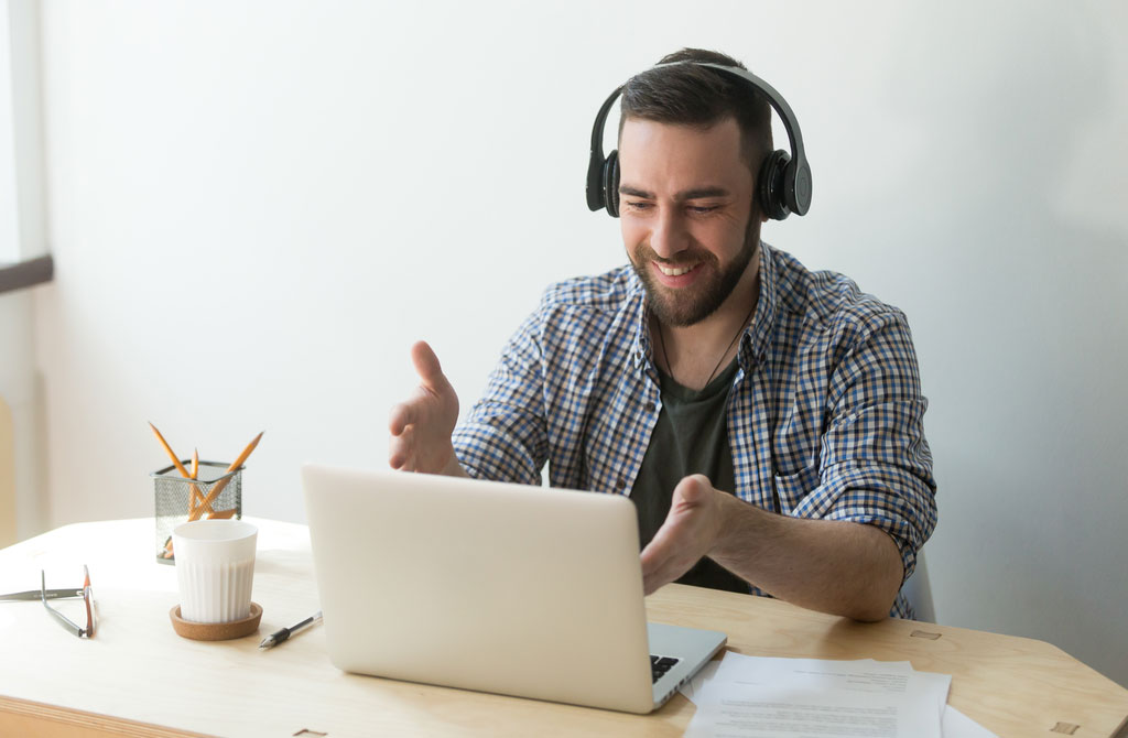 male worker headphones talking making video