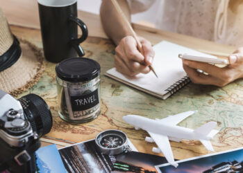 young woman planning vacation trip