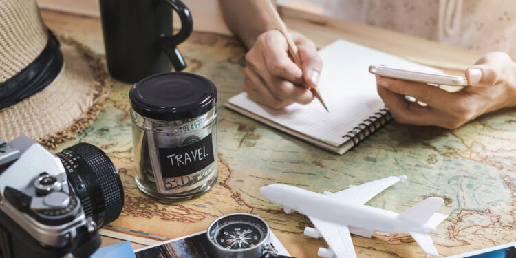 young woman planning vacation trip