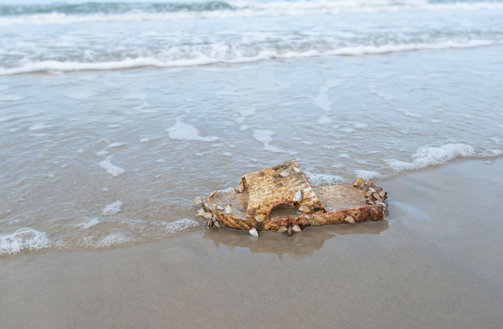 plastic shoes placed on beach