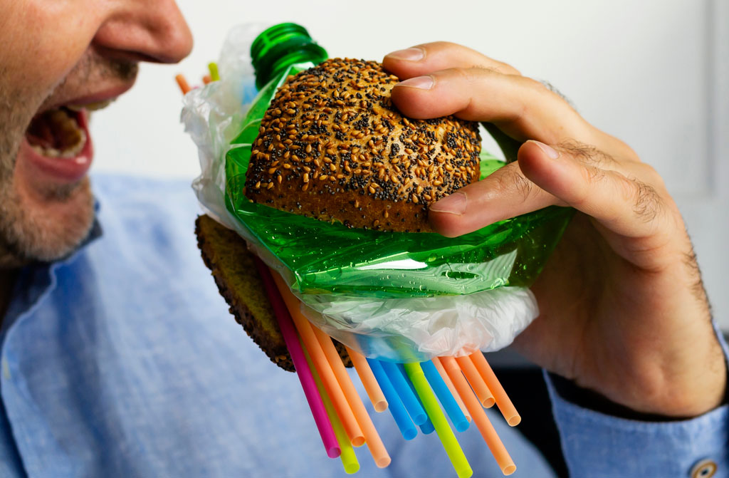 man eats burger of plastic made tasty