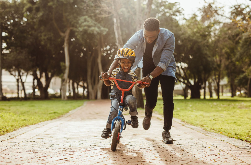 boy learning ride bicycle