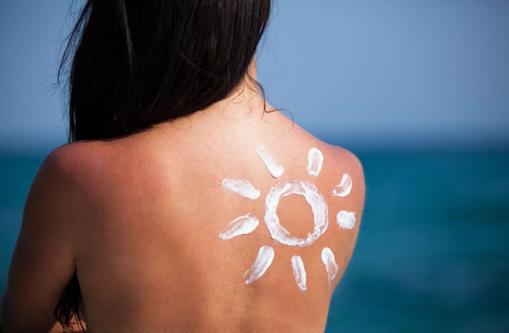 woman back sun lotion
