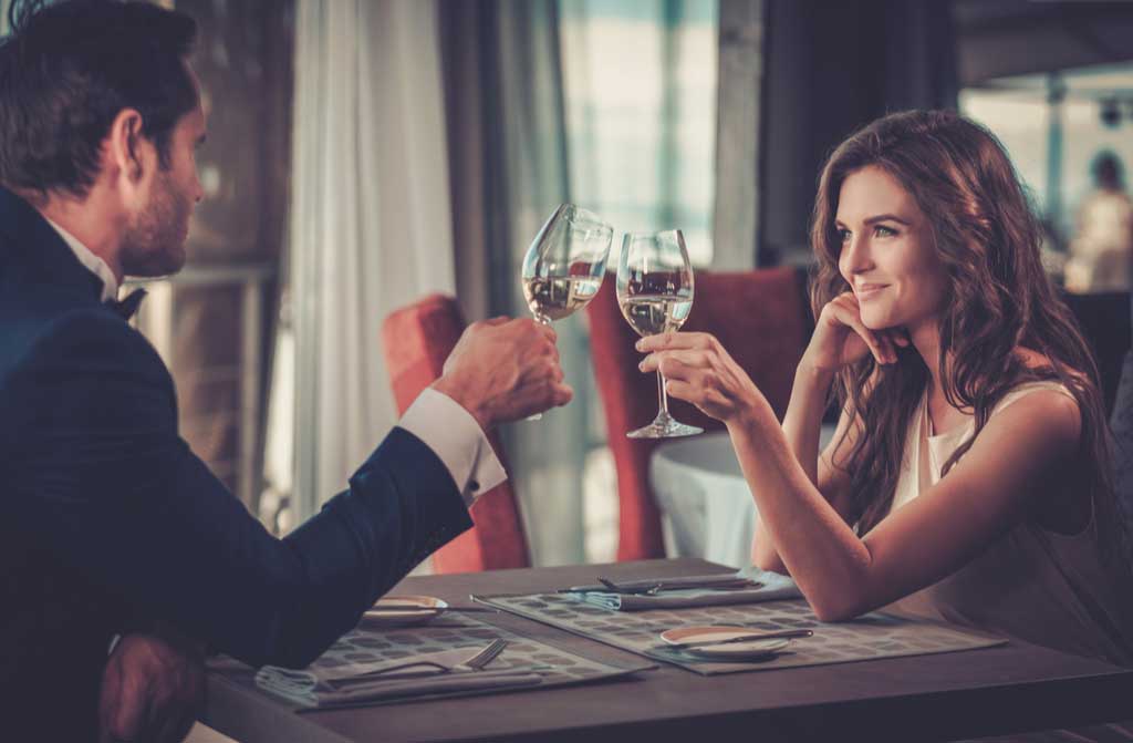 beautiful couple drinking on restaurant