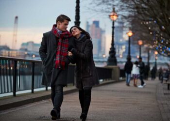 couple walking along south bank