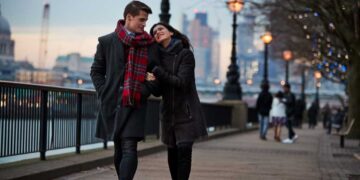 couple walking along south bank