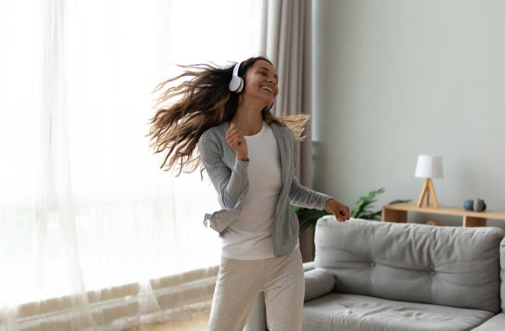 overjoyed woman millennial wearing headphones