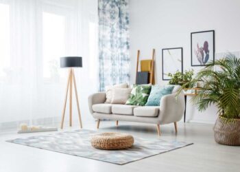 black lamp standing by sofa