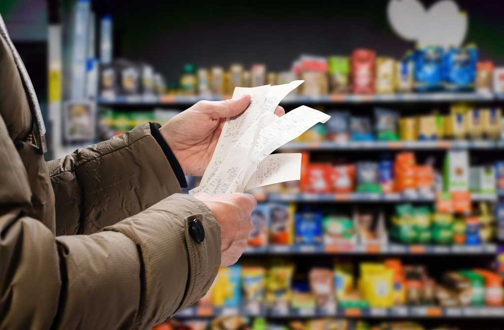 minded man viewing receipts