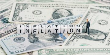 miniature businessman standing wise