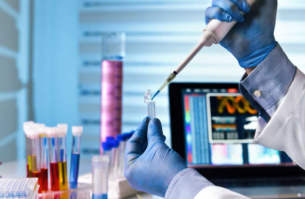 scientist holding tube medicine