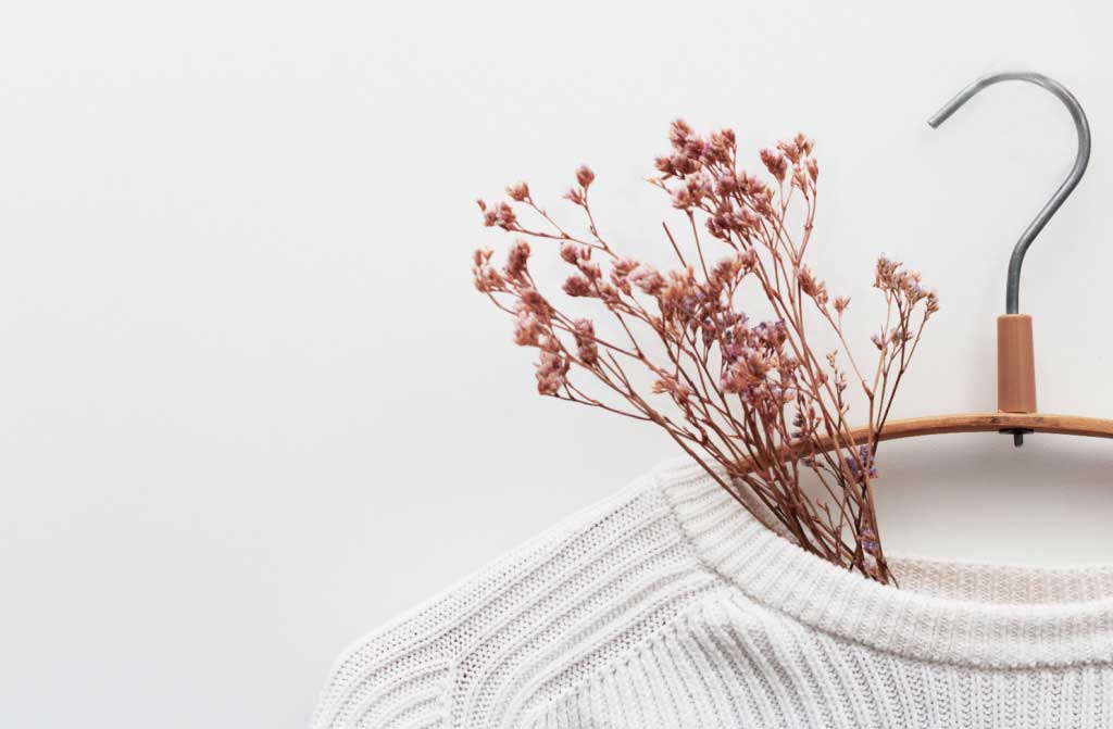 white kitted sweater flowers
