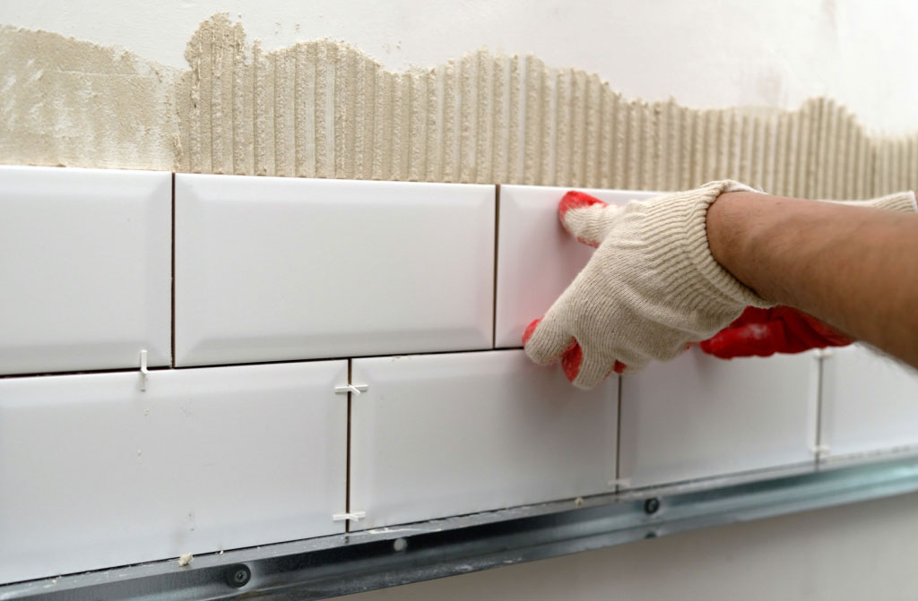 laying ceramic tiles in kitchen