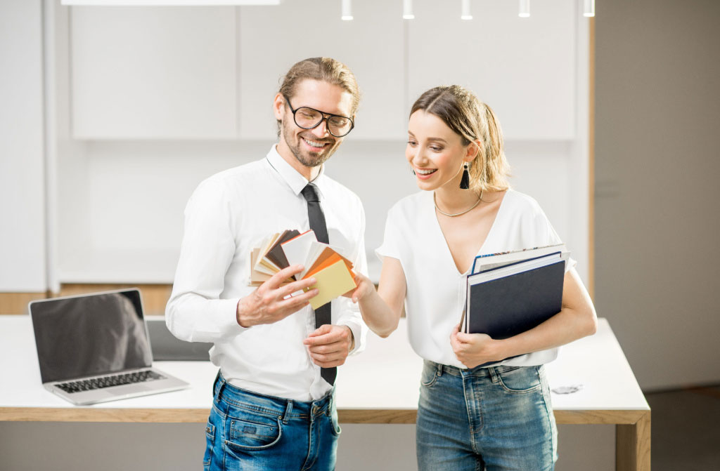 young couple designing new interior home