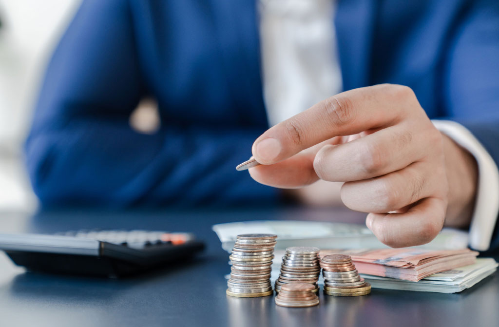 businessman holding dollar coins