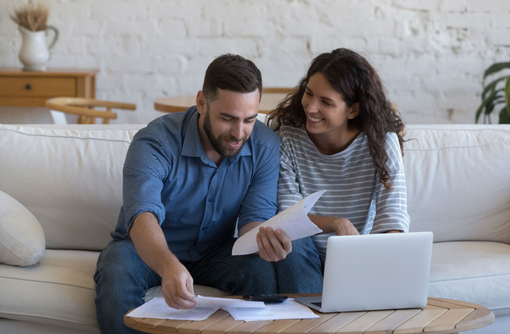 happy couple in 30s homeowners