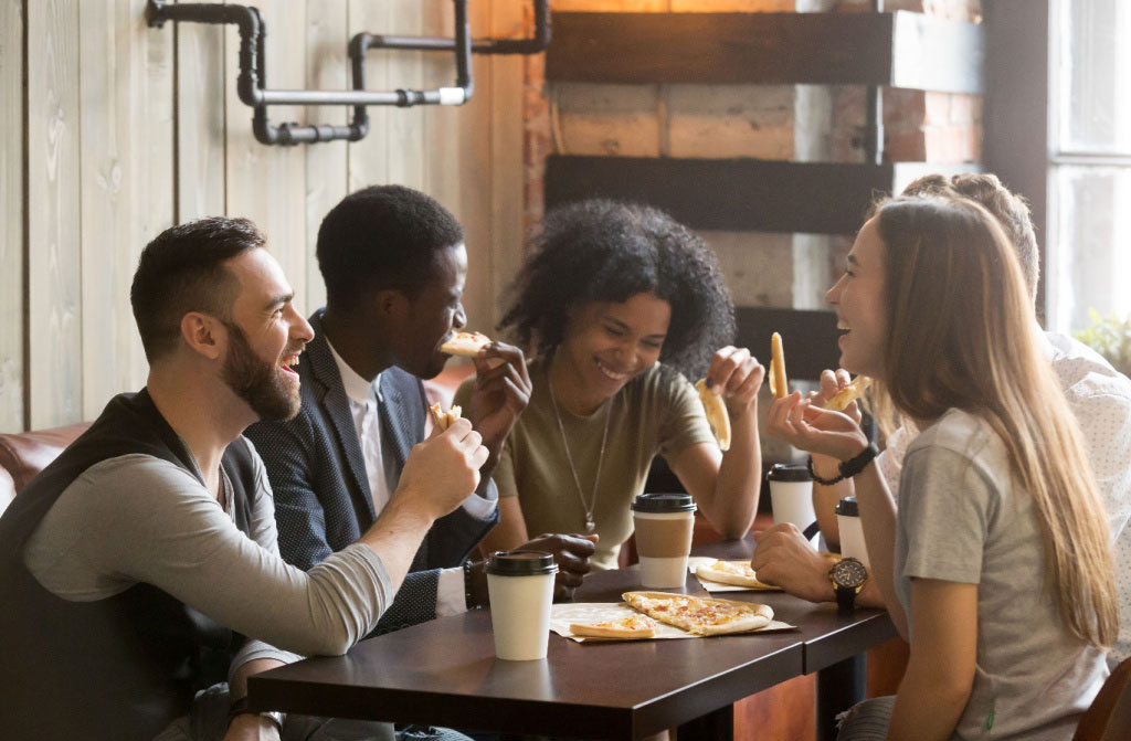 multiracial happy people eating