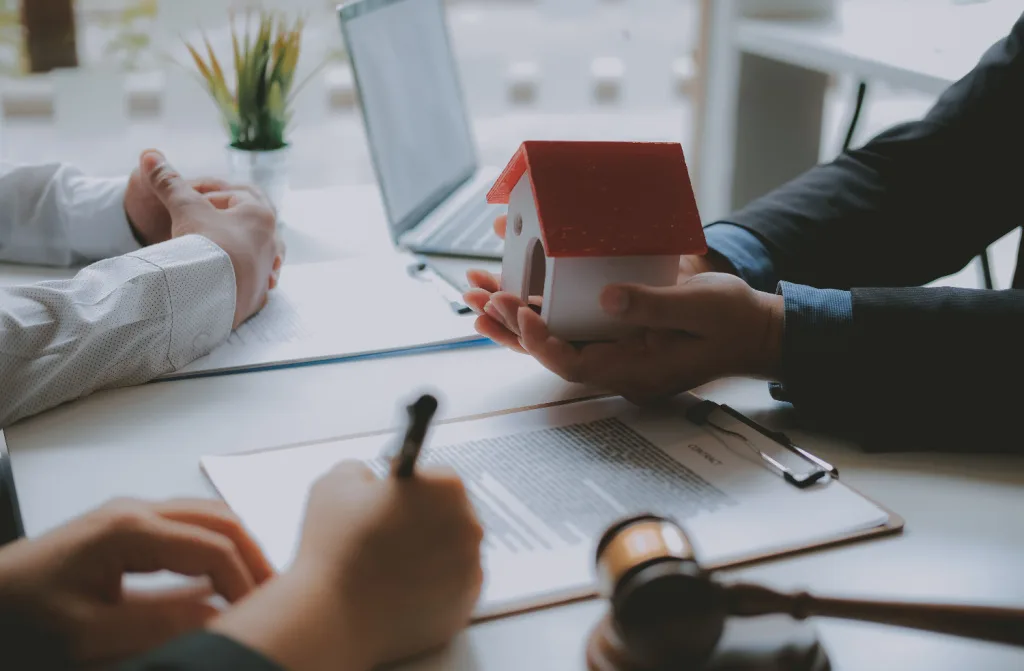 lawyer insurance broker showing a house