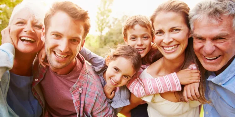 multigeneration family having fun together outdoors