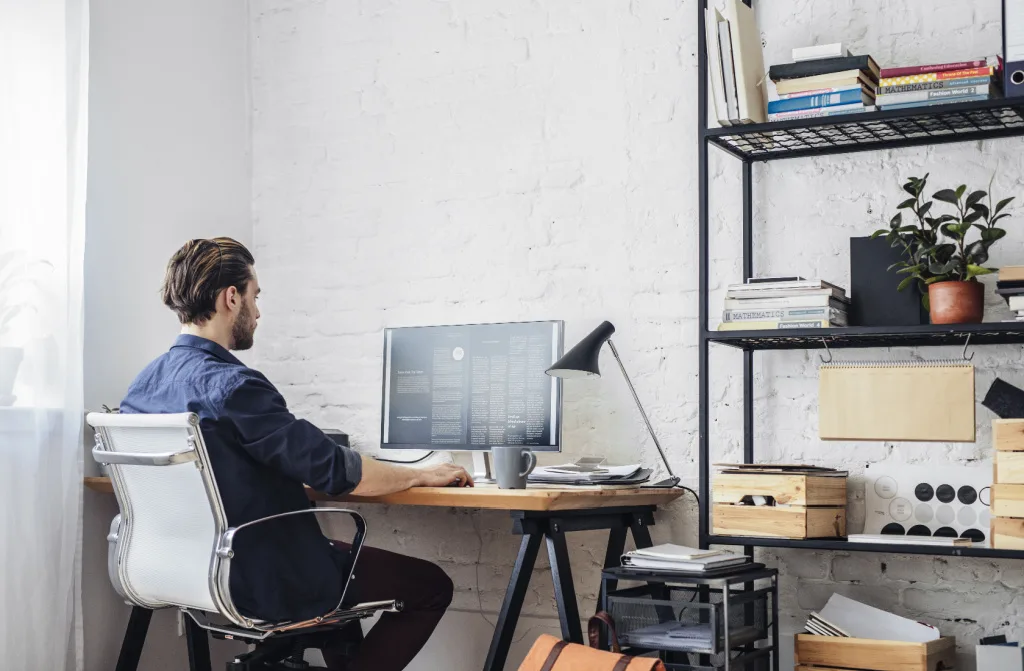 young man working on his computer