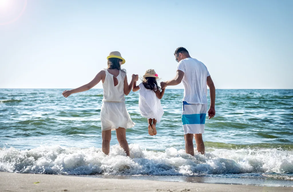 family having fun on the sea