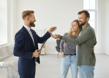 professional realtor standing empty living