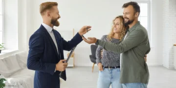 professional realtor standing empty living