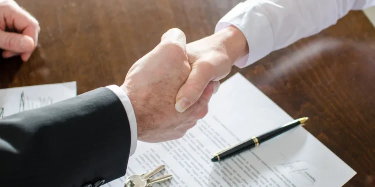 estate agents shaking hands